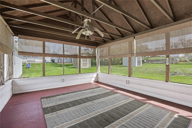 unfurnished sunroom with ceiling fan