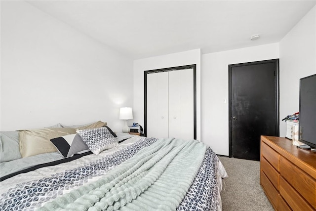 bedroom with light colored carpet and a closet