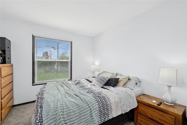 bedroom with light colored carpet