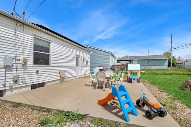 view of patio featuring fence and outdoor dining space