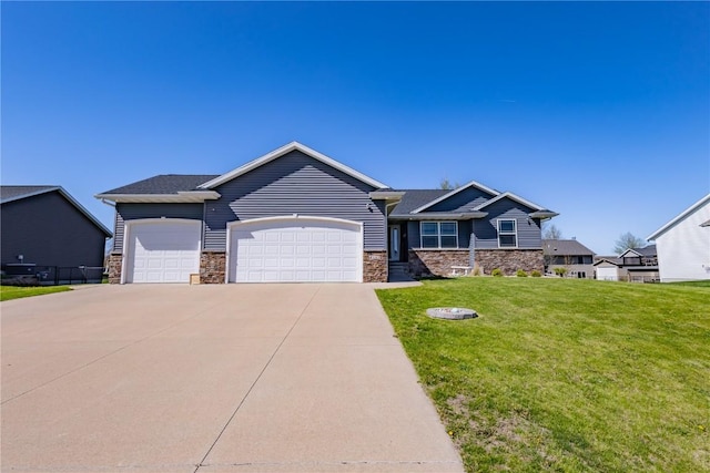craftsman house featuring an attached garage, a front lawn, driveway, and stone siding
