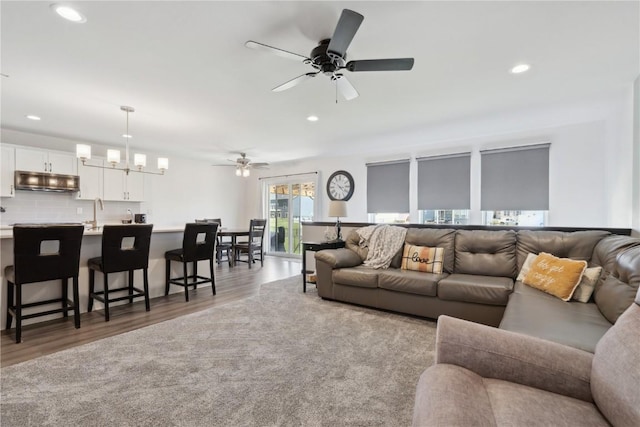 living area featuring recessed lighting and light wood finished floors