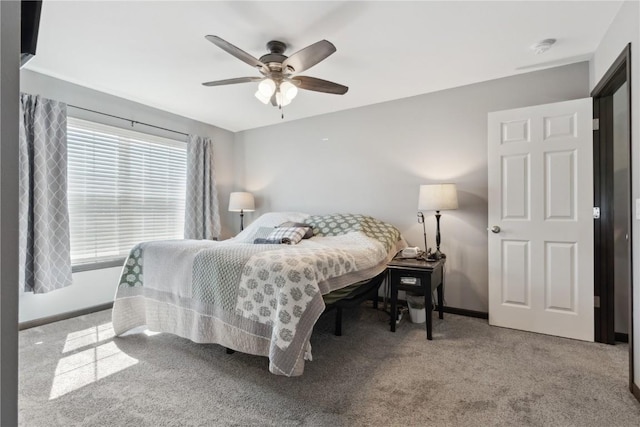 bedroom featuring carpet floors, baseboards, and ceiling fan