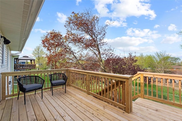 wooden deck featuring a gazebo