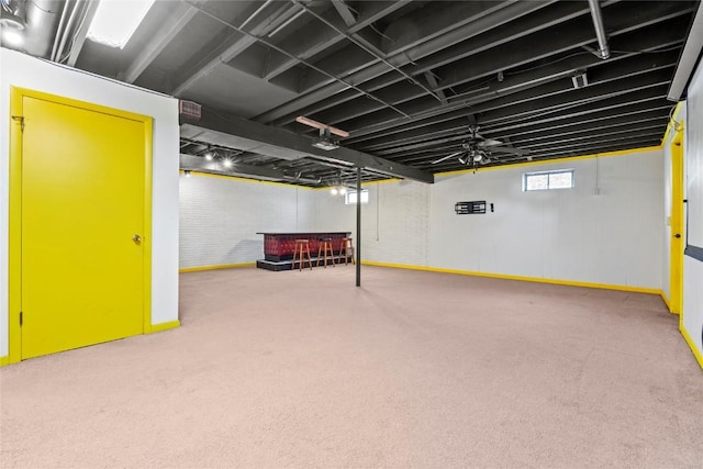 below grade area with baseboards and carpet