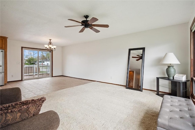 living area with baseboards, light carpet, and ceiling fan with notable chandelier
