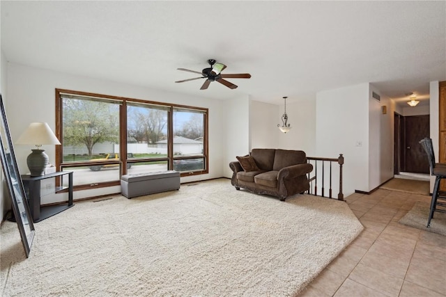 40 11th Ave, Hiawatha, IA 52233 - living area with ceiling fan and light tile patterned floors