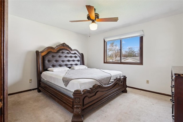 bedroom with baseboards, light colored carpet, and ceiling fan