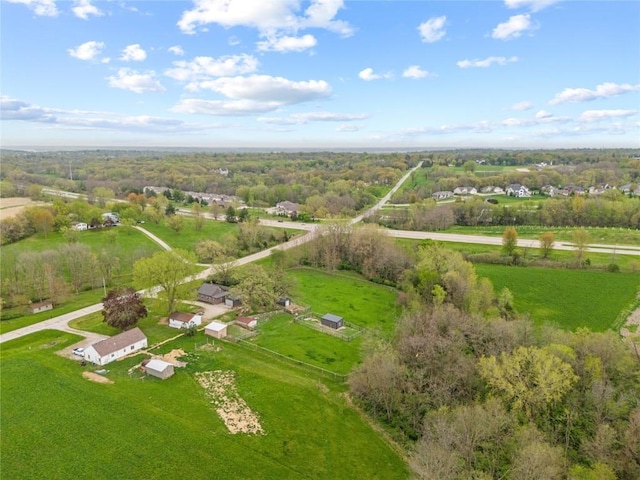 aerial view featuring a wooded view