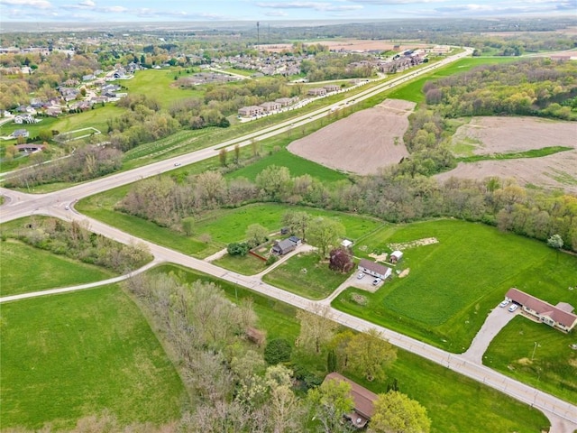 birds eye view of property with a rural view