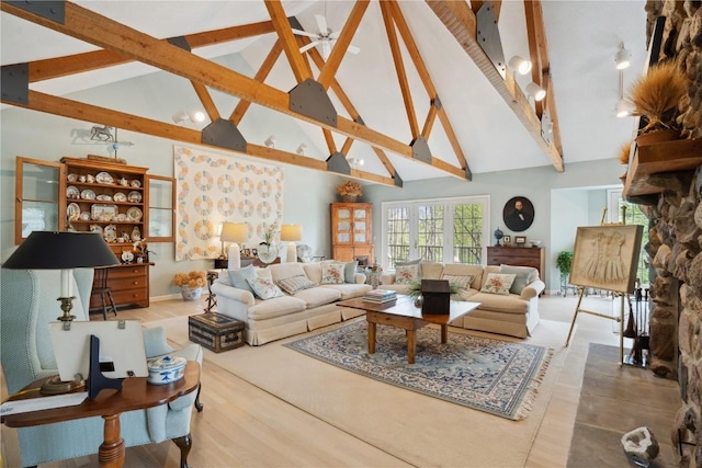 living room featuring high vaulted ceiling, ceiling fan, and beamed ceiling