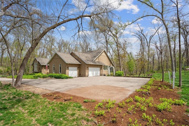 view of home's exterior with driveway and a garage