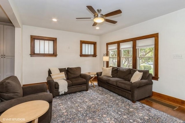 living area featuring baseboards, a ceiling fan, wood finished floors, and recessed lighting