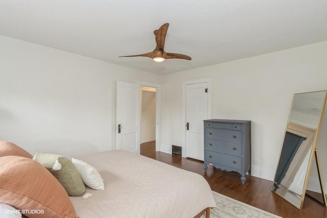 bedroom featuring ceiling fan and dark wood finished floors