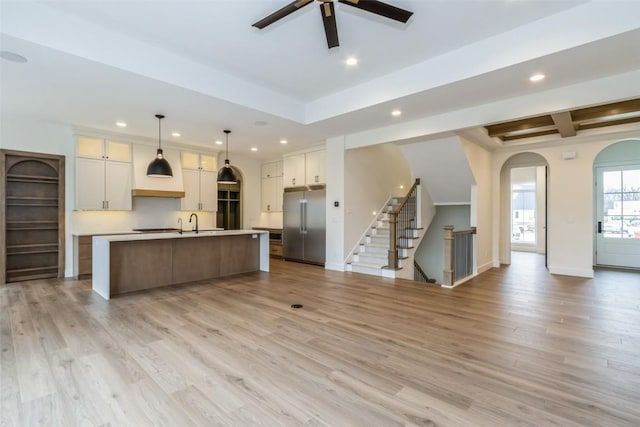 938 Heron Pl, Iowa City, IA 52245 - kitchen with light countertops, recessed lighting, open floor plan, and built in fridge