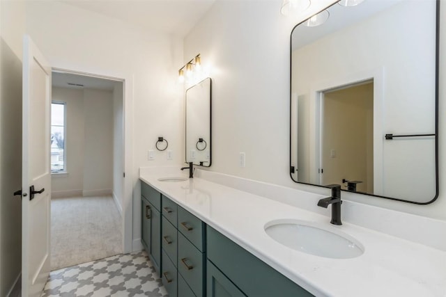 938 Heron Pl, Iowa City, IA 52245 - full bath with a sink, baseboards, tile patterned floors, and double vanity