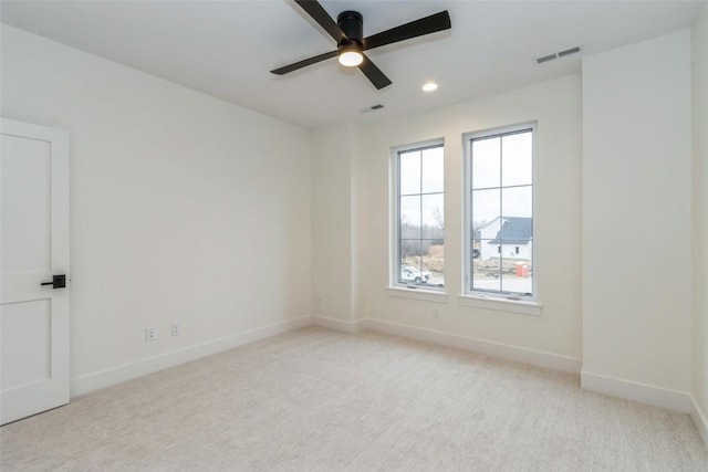 938 Heron Pl, Iowa City, IA 52245 - empty room featuring ceiling fan, light colored carpet, visible vents, baseboards, and recessed lighting