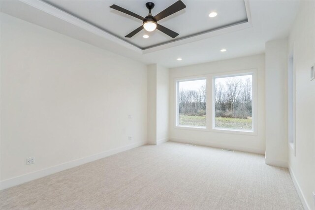 938 Heron Pl, Iowa City, IA 52245 - carpeted spare room with recessed lighting, ceiling fan, baseboards, and a raised ceiling