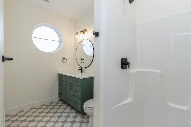 938 Heron Pl, Iowa City, IA 52245 - full bath with vanity, toilet, baseboards, walk in shower, and tile patterned floors