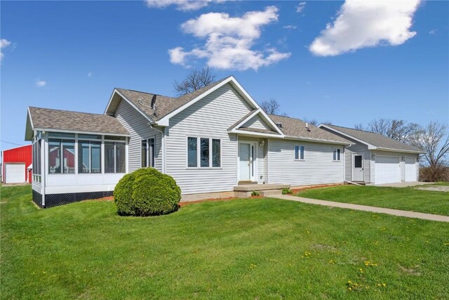 5141 25th Ave, Brandon, IA 52210 - single story home with a detached garage, a sunroom, and a front yard