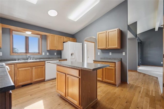 5141 25th Ave, Brandon, IA 52210 - kitchen with white appliances, vaulted ceiling, a sink, and light wood finished floors
