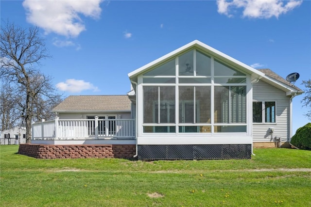 5141 25th Ave, Brandon, IA 52210 - rear view of property featuring a sunroom and a yard