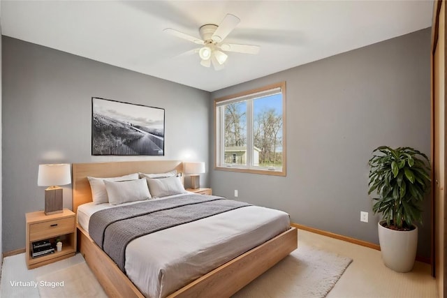 5141 25th Ave, Brandon, IA 52210 - bedroom with a ceiling fan, baseboards, and light colored carpet