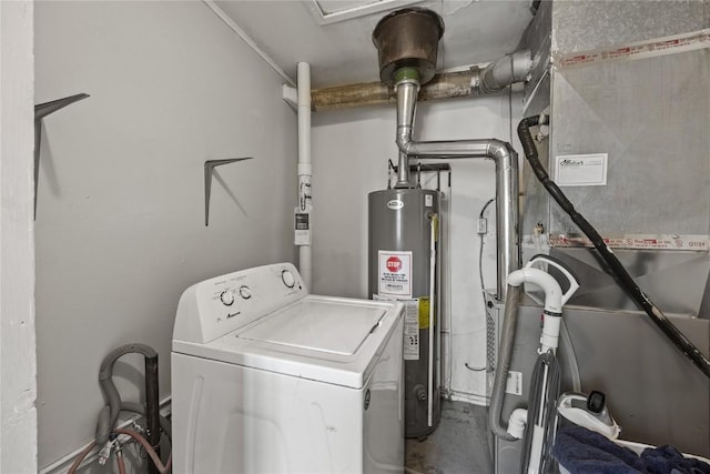 clothes washing area with heating unit, gas water heater, washer / clothes dryer, and laundry area
