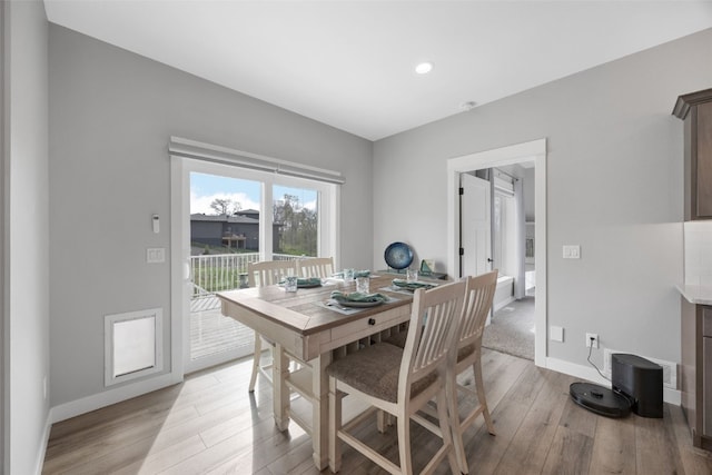 dining area with baseboards, recessed lighting, and light wood-style flooring