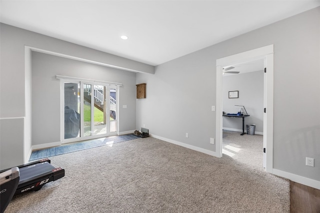 interior space with baseboards, ceiling fan, carpet, and recessed lighting