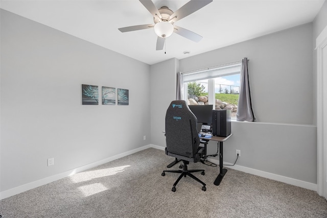 office with a ceiling fan, baseboards, and carpet