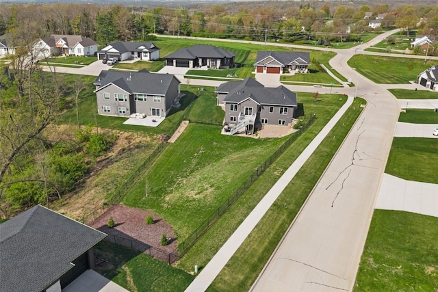 birds eye view of property with a residential view