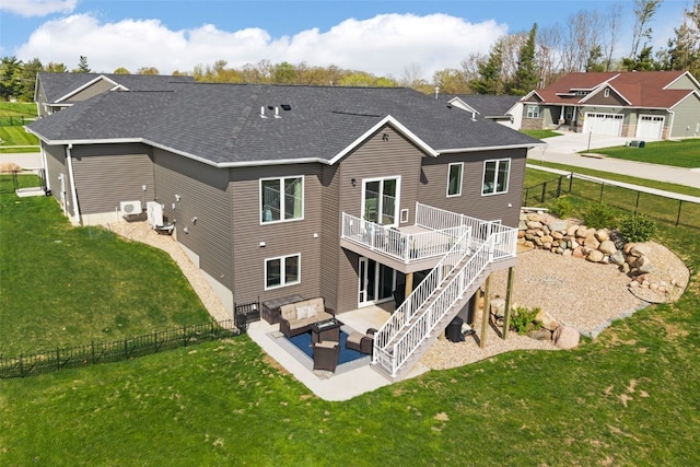 back of house with a fenced backyard, a wooden deck, a shingled roof, and an outdoor living space