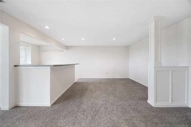 carpeted empty room featuring recessed lighting and baseboards