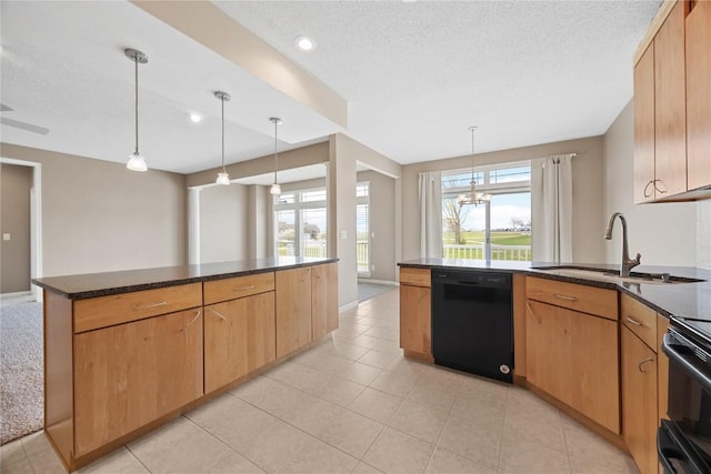 kitchen featuring a peninsula, dark stone counters, a textured ceiling, a sink, and black appliances