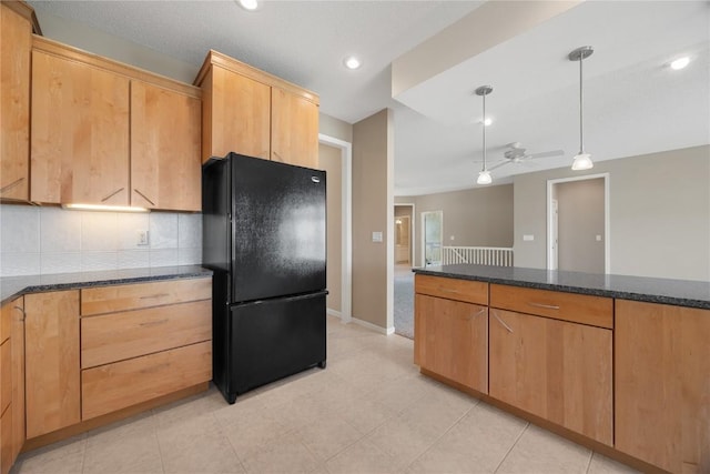 kitchen featuring decorative backsplash, a ceiling fan, decorative light fixtures, freestanding refrigerator, and recessed lighting