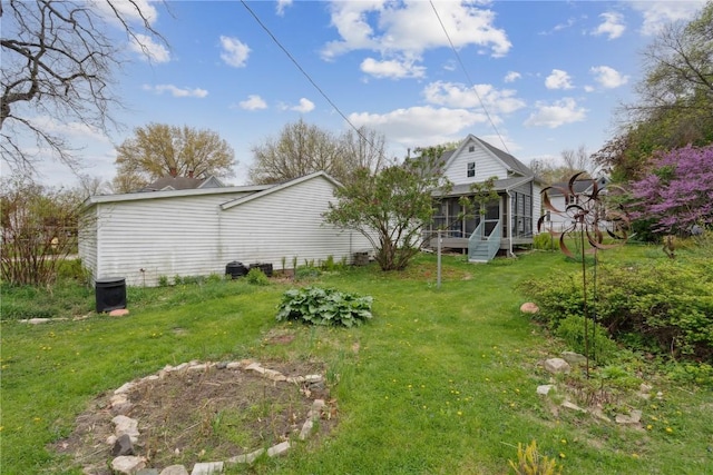 view of yard with a sunroom