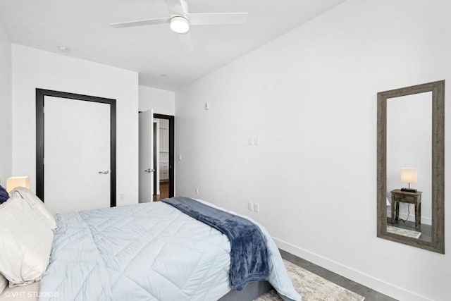bedroom with baseboards and a ceiling fan