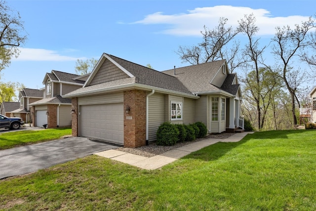view of front of property featuring driveway, brick siding, a front lawn, an attached garage, and a shingled roof