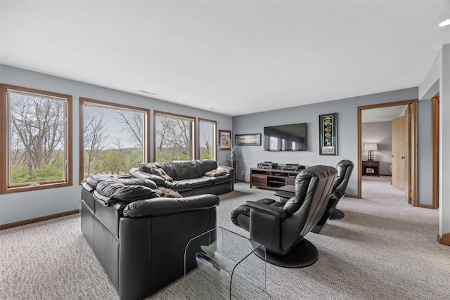 living room with baseboards and carpet