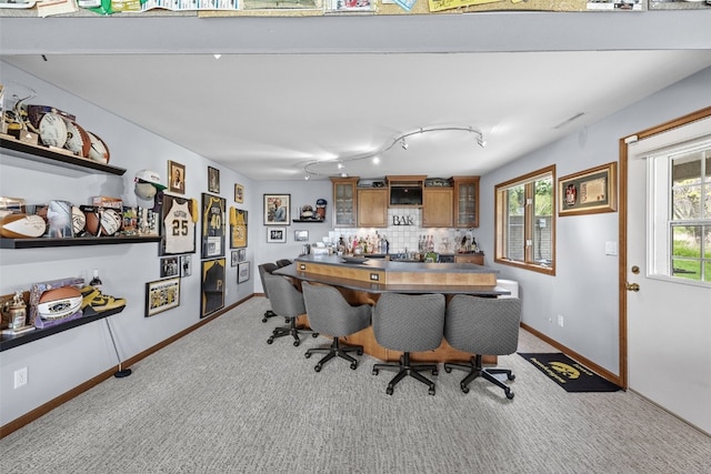 carpeted office space with baseboards