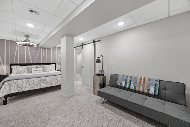 bedroom with a barn door, carpet floors, a paneled ceiling, recessed lighting, and visible vents