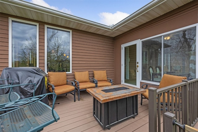 wooden terrace featuring an outdoor hangout area