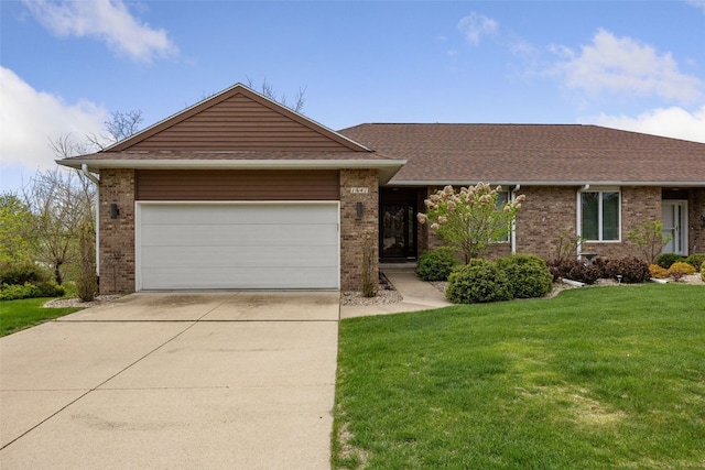 ranch-style house with an attached garage, concrete driveway, a front lawn, and brick siding