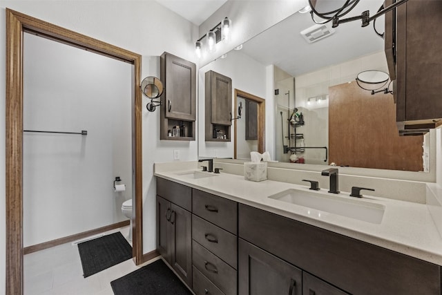 full bath with visible vents, a sink, toilet, and a shower stall