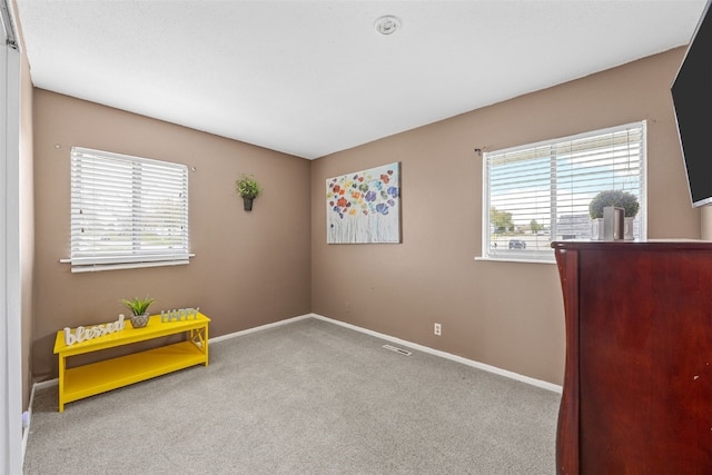 interior space featuring baseboards and visible vents