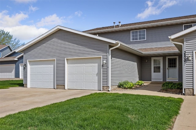 view of front of home with driveway and a garage