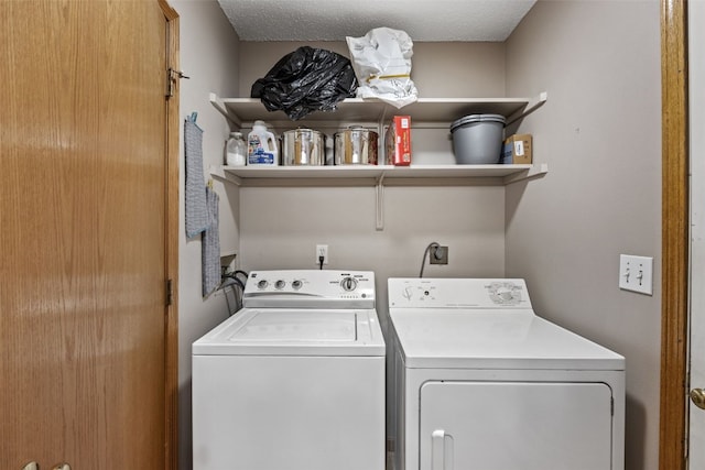 clothes washing area with laundry area and washer and dryer