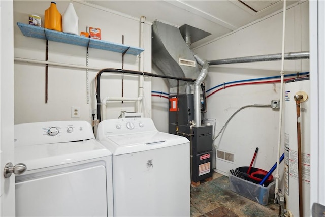 3815 Oakland Rd NE, Cedar Rapids, IA 52402 - laundry area featuring laundry area, water heater, washer and dryer, and visible vents