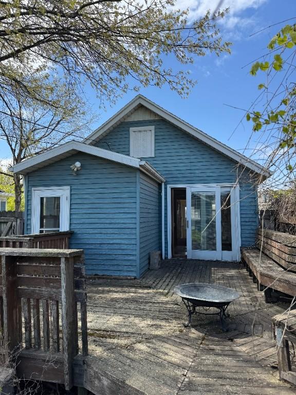 rear view of property with a deck
